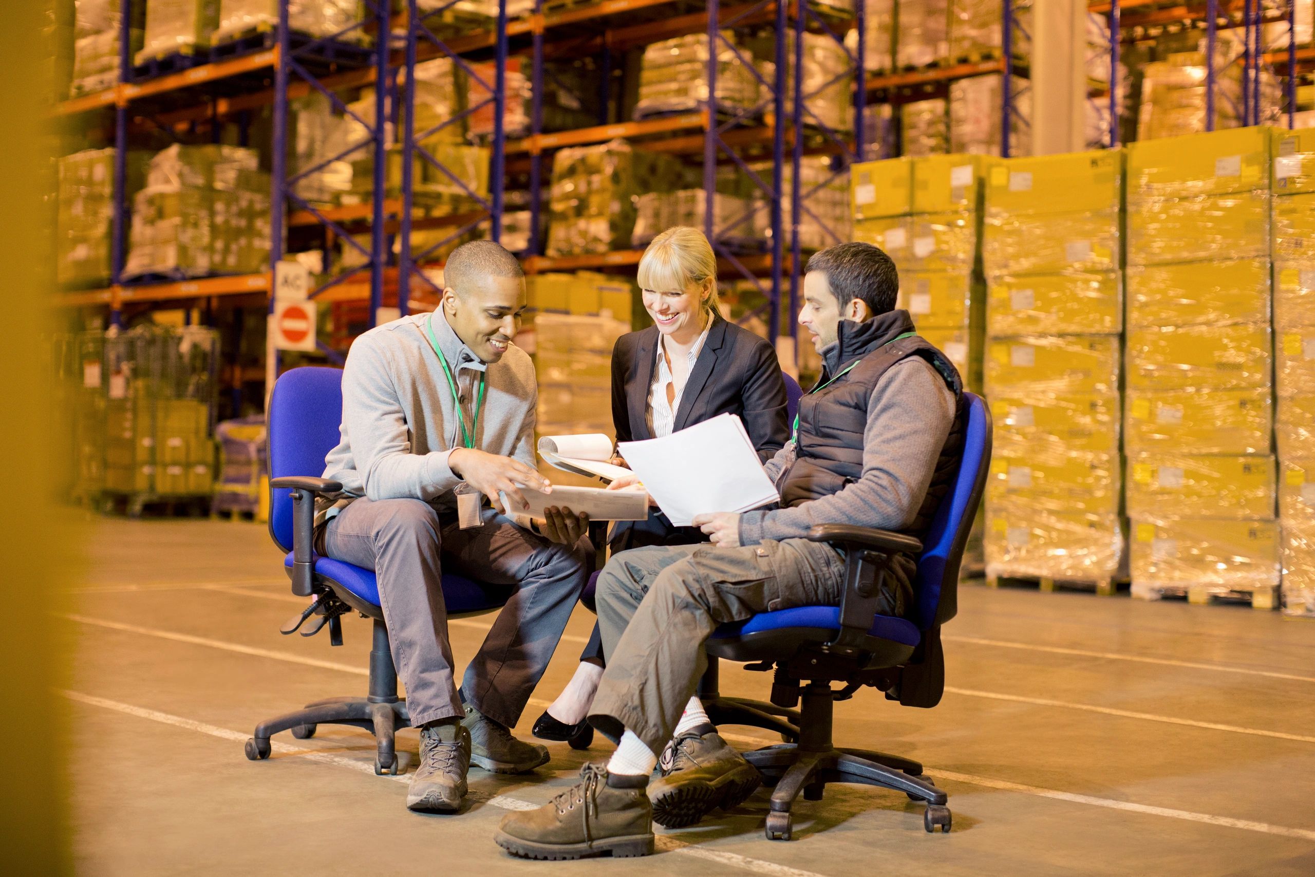 Warehouse team reviewing documents