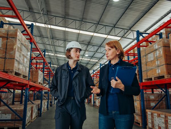Professionals walking through warehouse